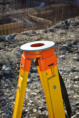 Surveyor tripod outdoors at construction site