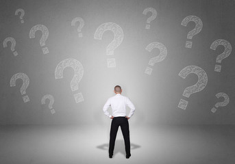 Confused Businessman with Question Marks