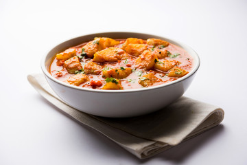 Indian food - Aloo curry masala. Potato cooked with spices and herbs in a tomato curry. served in a...