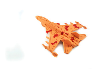 fighter toy isolated on white background / military toy airplane orange
