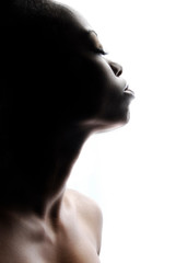 Profile of a young woman in lowkey light