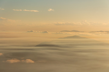 Low cloud lies over a warm landscape