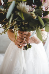 Bride Holding Bouquet Wedding Ring