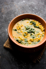Dal Palak or Lentil spinach curry - popular Indian main course healthy recipe. served in a karahi/pan or bowl. selective focus
