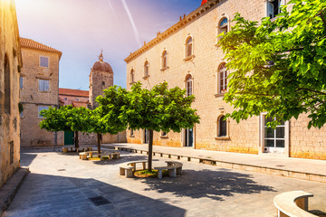 Naklejka premium View at town Trogir, old touristic place in Croatia Europe. Trogir town coastal view. Magnificent Trogir, Croatia. Sunny old Venetian town, Dalmatian Coast in Croatia.