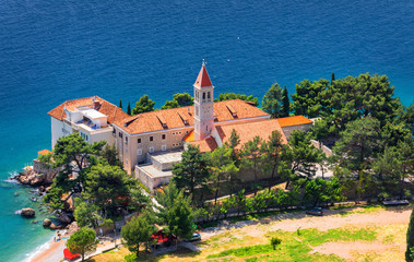 View of beautiful bay with beach and Dominican monastery in Bol town, Brac island, Croatia....