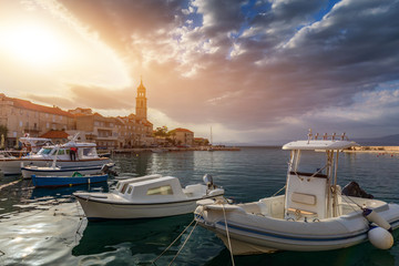 Obraz premium Fishing boat anchoring in beautiful Sutivan port, Brac island, Croatia. Sutivan on Island Brac in Croatia. Made of well known white limestone. Port with fishing boats. Sutivan, Brac, Croatia.
