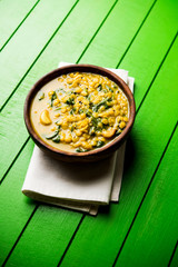 Dal Palak or Lentil spinach curry - popular Indian main course healthy recipe. served in a karahi/pan or bowl. selective focus