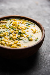 Dal Palak or Lentil spinach curry - popular Indian main course healthy recipe. served in a karahi/pan or bowl. selective focus