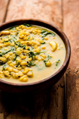 Dal Palak or Lentil spinach curry - popular Indian main course healthy recipe. served in a karahi/pan or bowl. selective focus