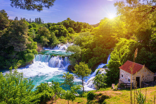 Fototapeta Waterfalls Krka, National Park, Dalmatia, Croatia. View of Krka National Park, Roski Slap location, Croatia, Europe. Beautiful world of Mediterranean countries. Traveling concept background.