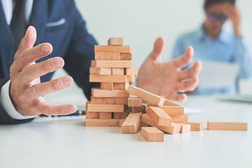 Problem Solving Business can't stop effect of dominoes continuous toppled with business team...