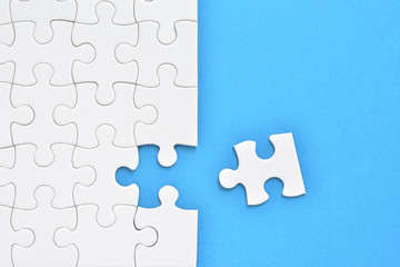 Jigsaw puzzle on a blue background 



