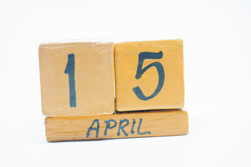 april 15th. Day 15 of month, handmade wood calendar isolated on white background. spring month, day of the year concept.