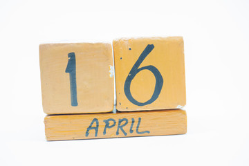 april 16th. Day 16 of month, handmade wood calendar isolated on white background. spring month, day of the year concept.