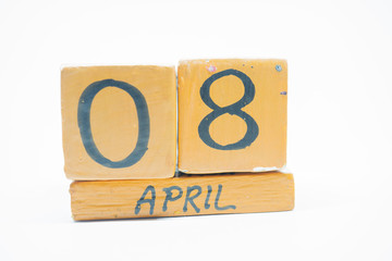april 8th. Day 8 of month, handmade wood calendar isolated on white background. spring month, day of the year concept.