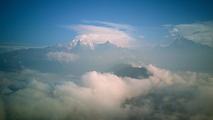 Naklejka premium Orange sunrise above mountain in valley Himalayas mountains