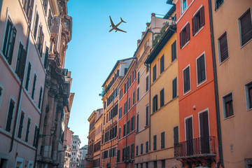 Obraz na płótnie Canvas plane flies over the ancient streets of Rome
