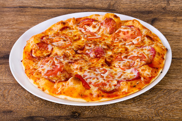 Pepperoni pizza with sausages