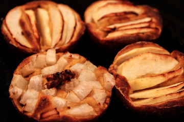 Small homemade apple pies freshly baked each in its mold