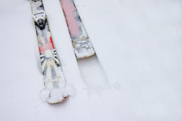 Skiing twintip. Ski twintip interesting lying in the snow. Freestyle, slopestyle skiing