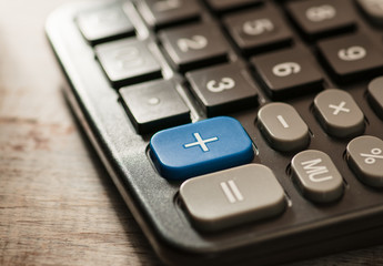background screen saver calendar, calculator, glasses, pen. wooden substrate