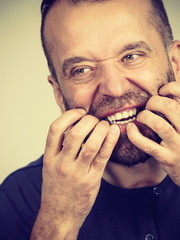 Man biting his nails