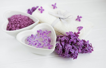 Spa towel and massage products with lilac flowers
