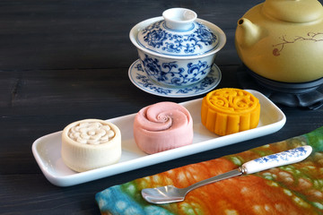 Mooncake is a Chinese bakery product traditionally eaten during the Mid-Autumn Festival. The festival is for lunar appreciation and moon watching. Selective focus,blurred background with copy space