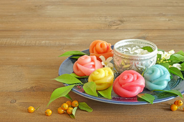 Layer sweet cake (Khanom Chan) Thai traditional dessert in colorful roses shape , Thai food / Thai dessert sweet and delicious. Copy space for texts