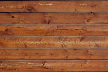 Fototapeta premium Wooden brown background is from lying horizontally boards Wall of wooden horizontal boards