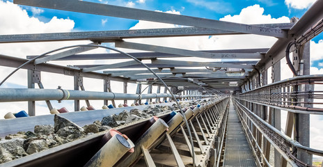 Fototapeta premium Platinum Mining and Processing of ore, Platinum rock being moved on a conveyor belt