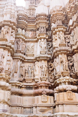 Ancient bas-relief at famous erotic temple in Khajuraho, India.