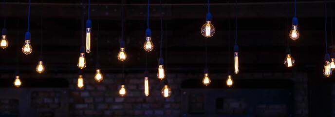 Luxury retro light bulb glowing Vintage style light bulbs hanging from the ceiling Many decorative light bulbs