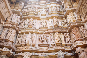 Ancient bas-relief at famous erotic temple in Khajuraho, India.