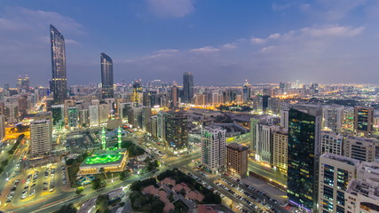 Fototapeta na wymiar Modern city architecture of Abu Dhabi skyline day to night timelapse, UAE.