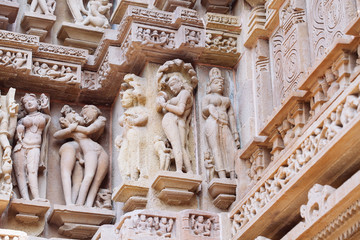 Ancient bas-relief at famous erotic temple in Khajuraho, India.