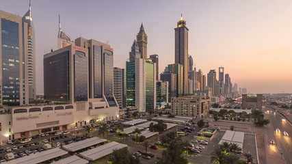 Obraz premium Downtown Dubai towers day to night timelapse. Aerial view of Sheikh Zayed road with skyscrapers after sunset.