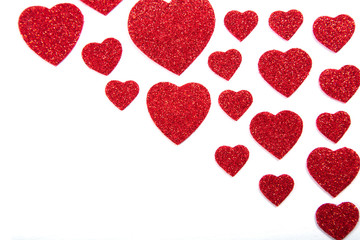 Valentine's Day, silver and red hearts on a white background with empty space