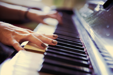 Closeup of antique piano keys and wood grain