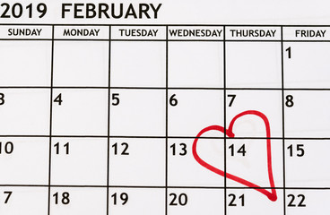 monthly calendar February detail view with a red heart drawn on the fourteenth for Valentine's Day as a reminder
