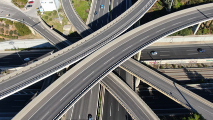 Aerial view of popular highway of Attiki Odos multilevel junction road, passing through National motorway in traffic jam, Attica, Greece