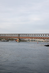 Obraz premium Riverside view, boat, river, bridge