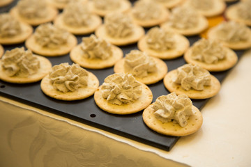 horizontal image with detail of open sandwiches with walnut sauce