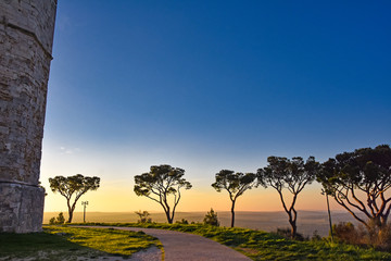 Obraz premium Italy, Castel del Monte, surrounding nature sunset