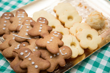 horizontal image with detail of a tray with nice Christmas cookies