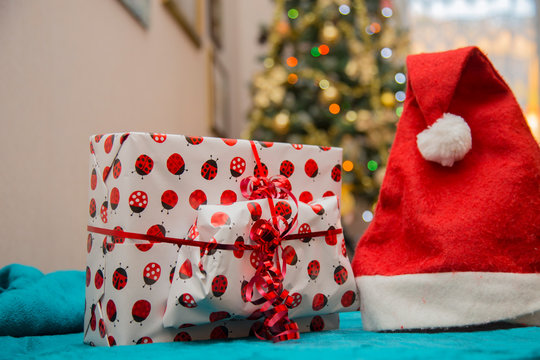 horizontal image with detail of a gift bag and a Christmas Santa hat