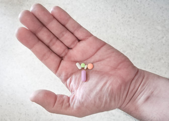 Medications in a man's hand