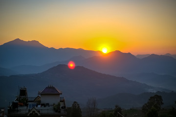 Obraz na płótnie Canvas Sunset behind the hills in Nepal