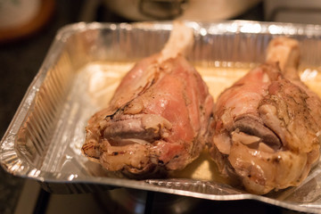 horizontal image with close up detail of a baked pork shank